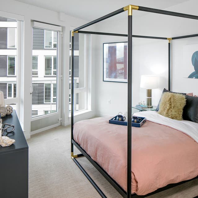 Rivage Apartments - Spacious Bedroom with Carpet flooring and Private Balcony