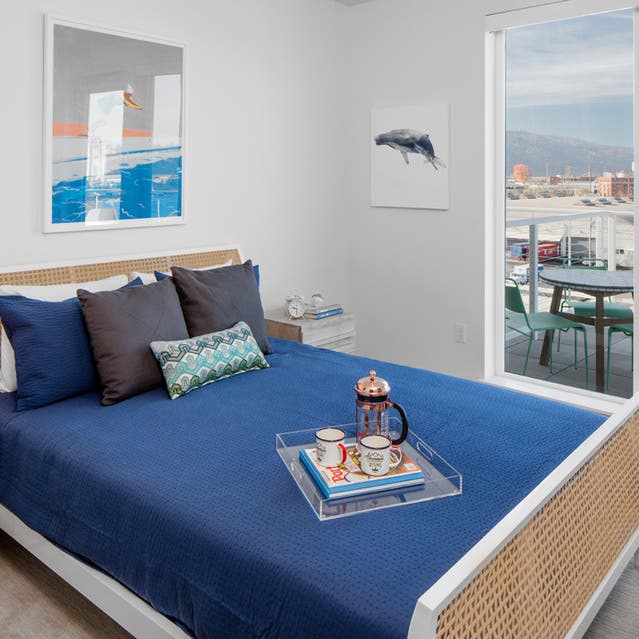 Rivage Apartments - Spacious Bedroom with Carpet Flooring and Private Balcony