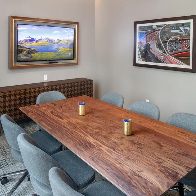Rivage Apartments - Private Conference Rooms with Table, Chairs and TV