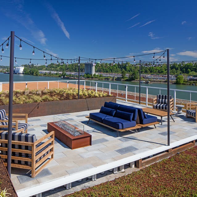 Rivage Apartments - Rooftop Terrace with Comfortable Seating and Firepit Overlooking Willamette River